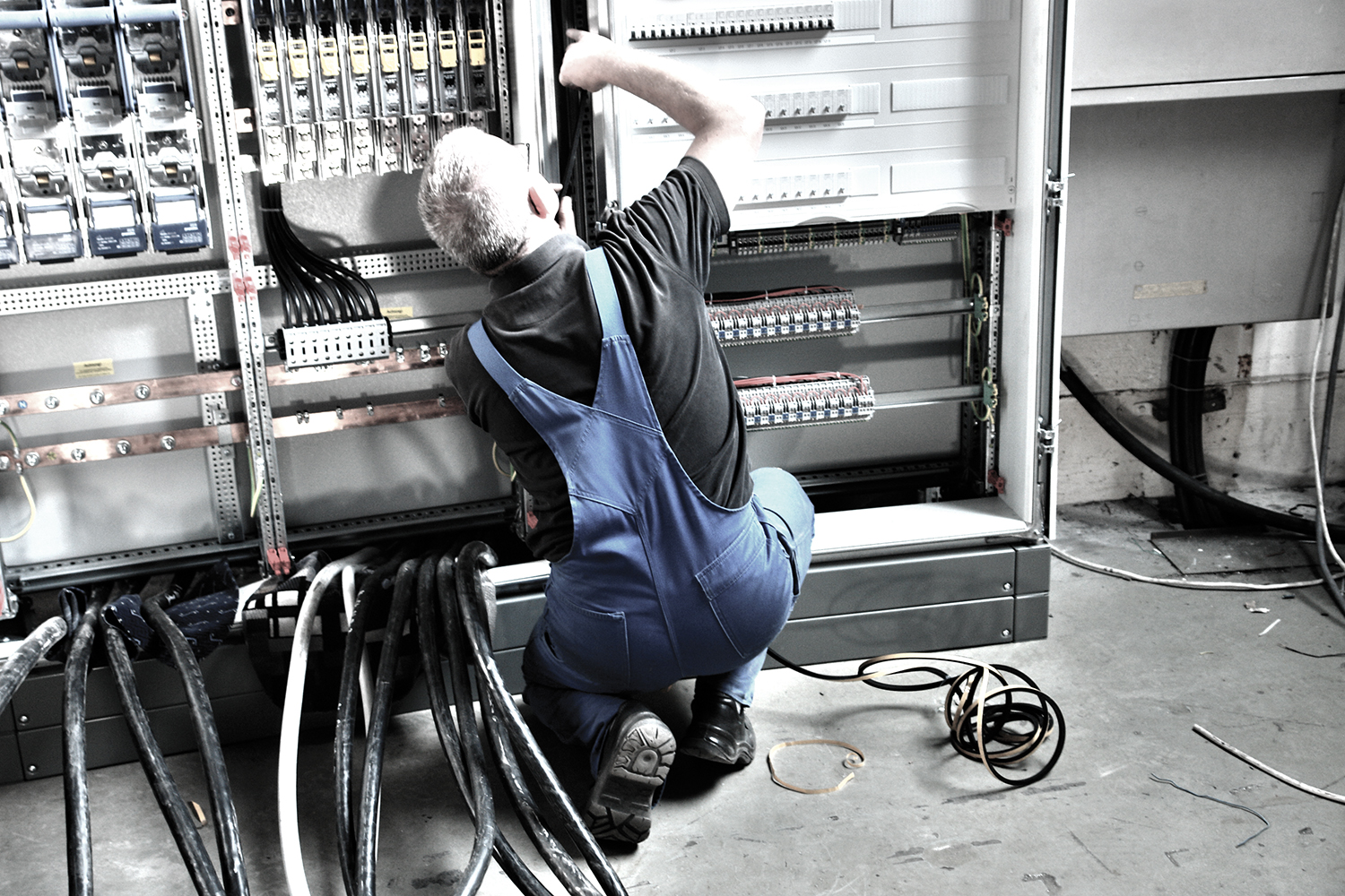 Service installer at an open switch box.